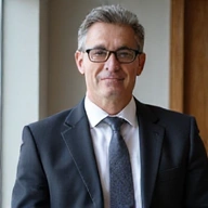 Professional headshot of Dr. Marcus Reed